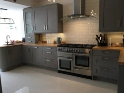 Gray kitchen interior with brown floor