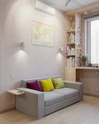 Photo of the interior of a small bedroom with a sofa