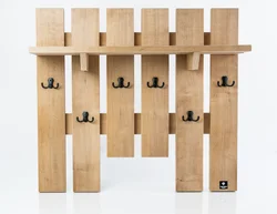 Photo of wall-mounted wooden clothes hangers in the hallway