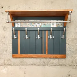 Photo Of Wall-Mounted Wooden Clothes Hangers In The Hallway