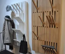 Photo Of Wall-Mounted Wooden Clothes Hangers In The Hallway