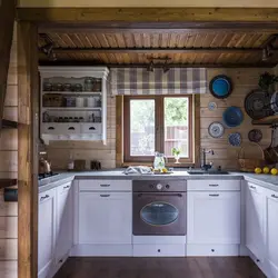 Photo of a kitchen in a country house with a window