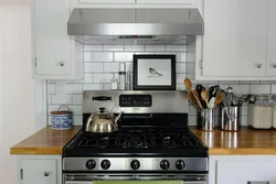 Gas stove in the interior of a small kitchen photo