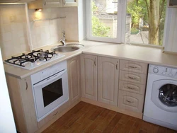 Gas stove in the interior of a small kitchen photo