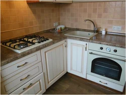 Gas stove in the interior of a small kitchen photo