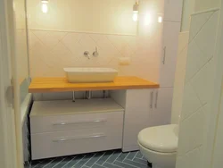 Bathroom cabinet with countertop photo