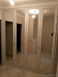 Hallway With Swing Doors And Mirror Photo