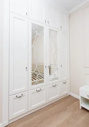 Hallway with swing doors and mirror photo