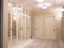 Hallway With Swing Doors And Mirror Photo