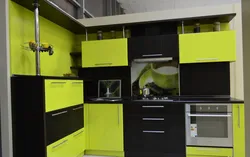 Photo of black and light green kitchen