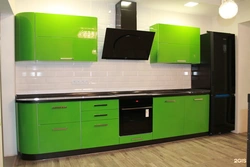 Photo of black and light green kitchen