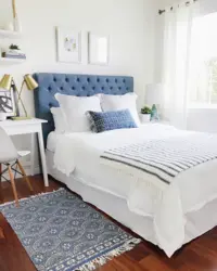Blue bed in the bedroom interior