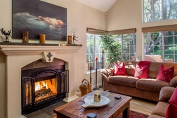 Bedroom design with sofa and fireplace