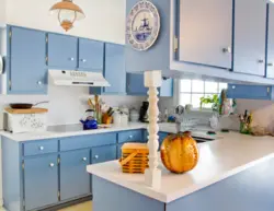 Blue kitchen with yellow photo