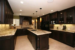 Dark kitchen with black countertop photo