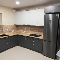 Black and white kitchen with wooden countertop photo