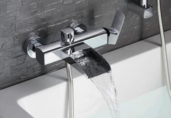 Bathroom faucet with shower built into the bathtub photo