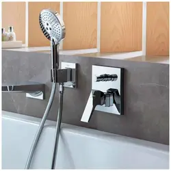 Bathroom faucet with shower built into the bathtub photo