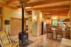 Living room in a wooden house with a stove photo