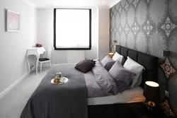 Bedroom interior with dark wall near the bed