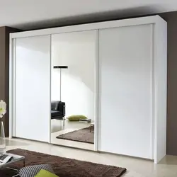 Three-leaf wardrobe in the bedroom photo