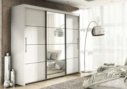Three-leaf wardrobe in the bedroom photo