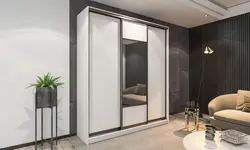Жатын бөлмесінің фотосуретіндегі үш жапырақты гардероб
