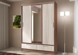 Three-leaf wardrobe in the bedroom photo