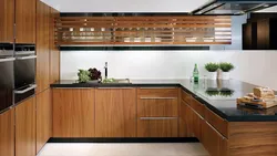 Wood kitchen with black countertop photo
