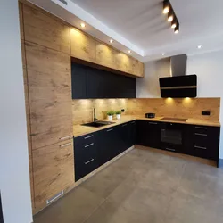 Wood kitchen with black countertop photo