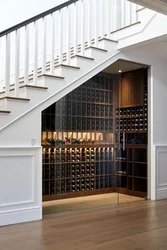 Dressing room under the stairs in the house photo