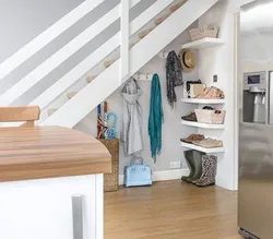 Dressing room under the stairs in the house photo