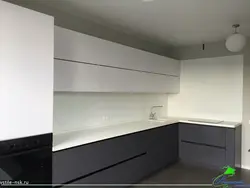 Gray white kitchen with black countertop photo