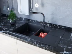 Black sink in the kitchen interior