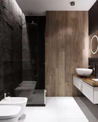 Bathroom design with dark tiles and wood