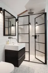 Photo of a bathroom with a black shower