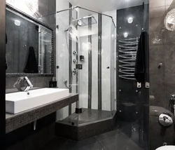 Photo of a bathroom with a black shower