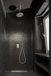 Photo of a bathroom with a black shower