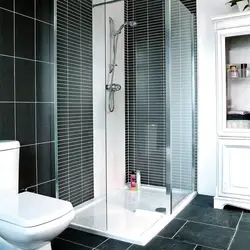 Photo of a bathroom with a black shower