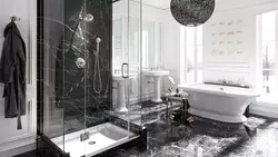 Photo of a bathroom with a black shower