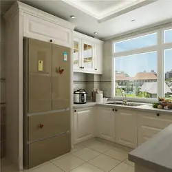 U-shaped kitchen with sink by the window photo