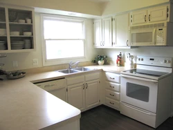 U-shaped kitchen with sink by the window photo