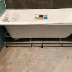 How to install a plastic bathtub photo