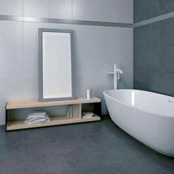 Light porcelain tiles in the bathroom interior photo
