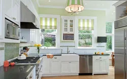 Kitchen design in a house with two windows photo