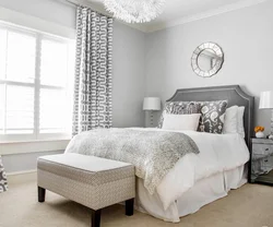 Curtains in a gray and white bedroom interior