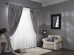 Curtains in a gray and white bedroom interior