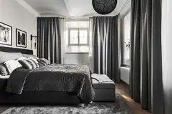 Curtains in a gray and white bedroom interior