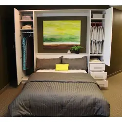 Room bedroom photo with bed and wardrobe