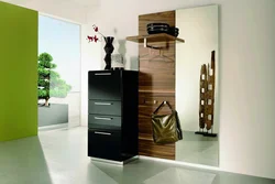 Hallway interior with shoe rack and mirror